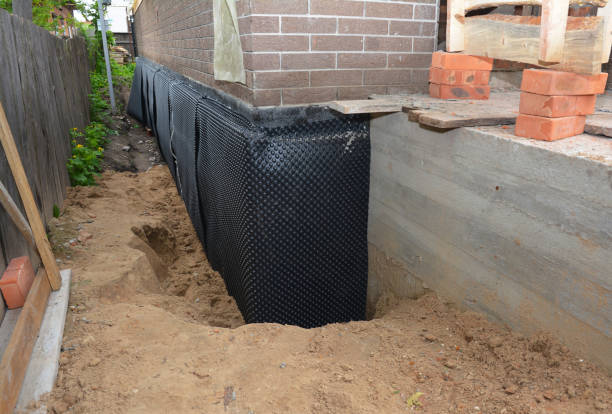Happy homeowners after waterproofing job in Mcbrides